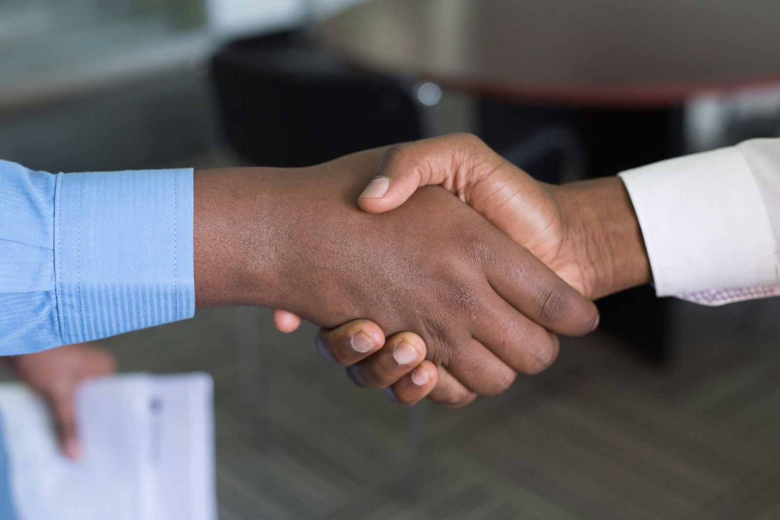 two person handshaking over international business insurance